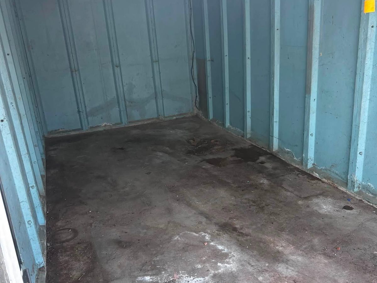 Empty, swept garage in Castle Vale, Birmingham after a full clearance by Rubbish Monsters Removal